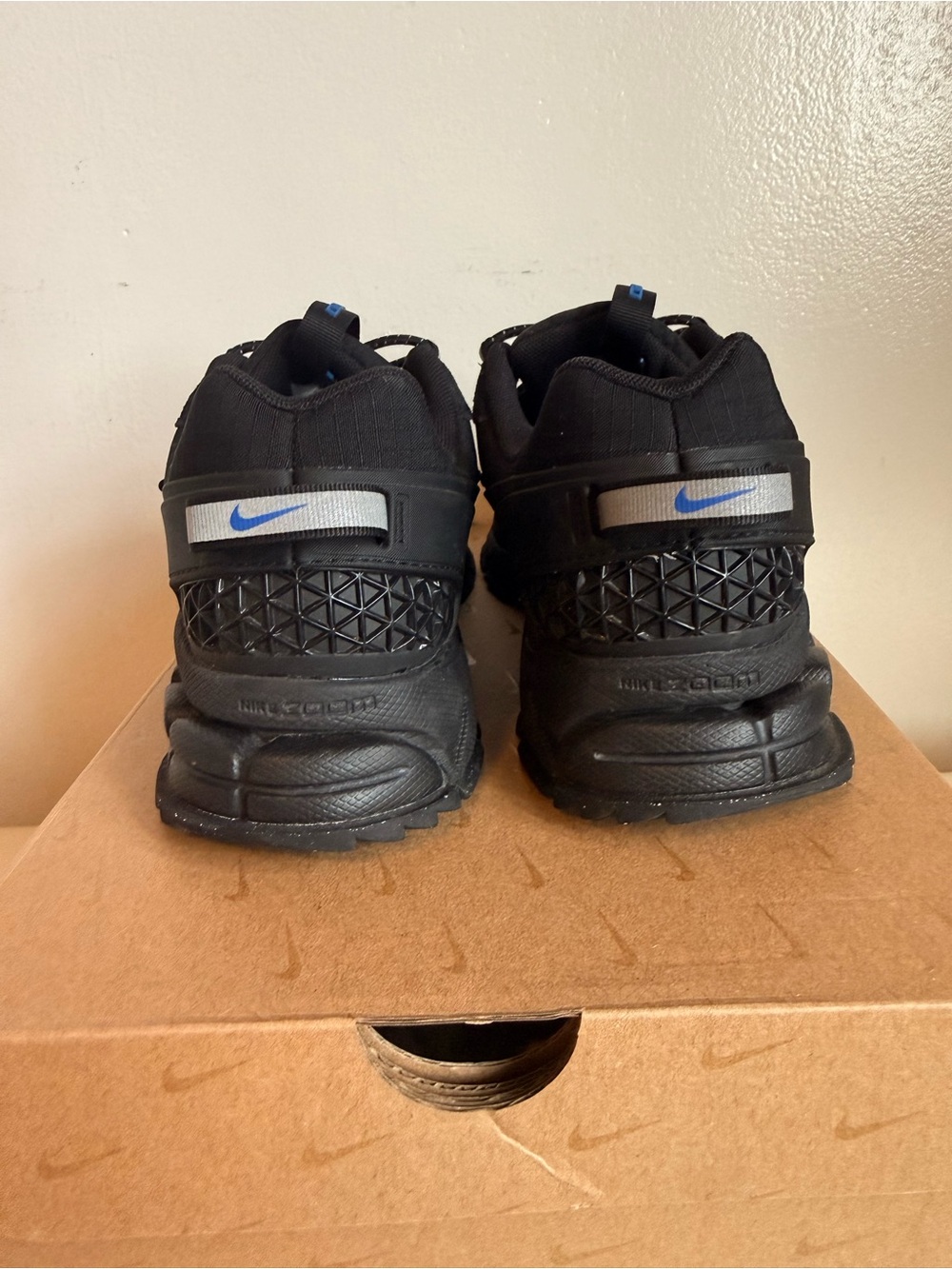 Nike women’s Black Sneakers with Blue Swoosh